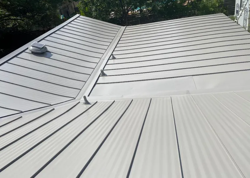 Solar attic fan installed on a metal roof for Roof Ventilation in Coachella